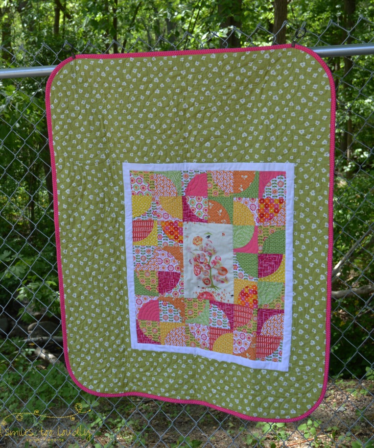 A baby girl quilt, with a drunkard's path border, by Smiles Too Loudly